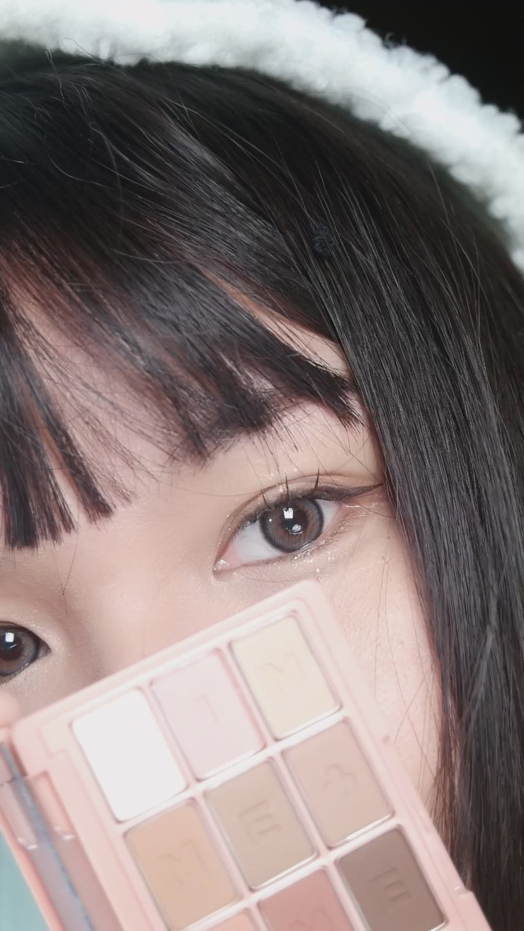 Model wearing EyeCandys coloured contact lenses, enhancing natural eye color with comfort and style. Available in brown, blue, and grey, these high-quality lenses offer a bold, vibrant look for everyday wear