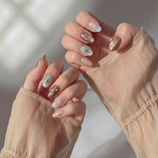 Hands wearing EyeCandys Press Bar press-on nails, showcasing a sleek, salon-quality manicure with clean application, smooth finish, and stylish design for an effortless everyday nail look.