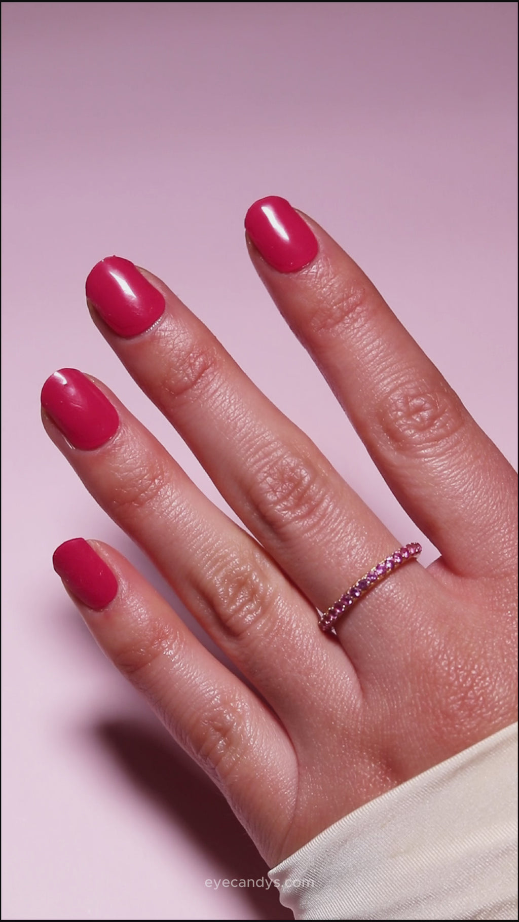Hand with EyeCandys Red My Mink Gel nail stickers applied, showcasing a bold red color. Ideal for classic, vibrant manicures, offering long-lasting wear, easy application, and a high-shine, salon-quality gel finish for stunning, polished nails.