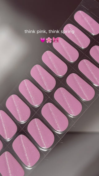  Video showing the step-by-step application of EyeCandys Pilates Princess Gel Nail Stickers in pink with glitter. Watch how easy it is to apply these 7-free, allergy-friendly stickers for salon-quality nails that last 2-3 weeks. Cures in sunlight without a UV lamp, perfect for trendy, sparkling spring nails.
