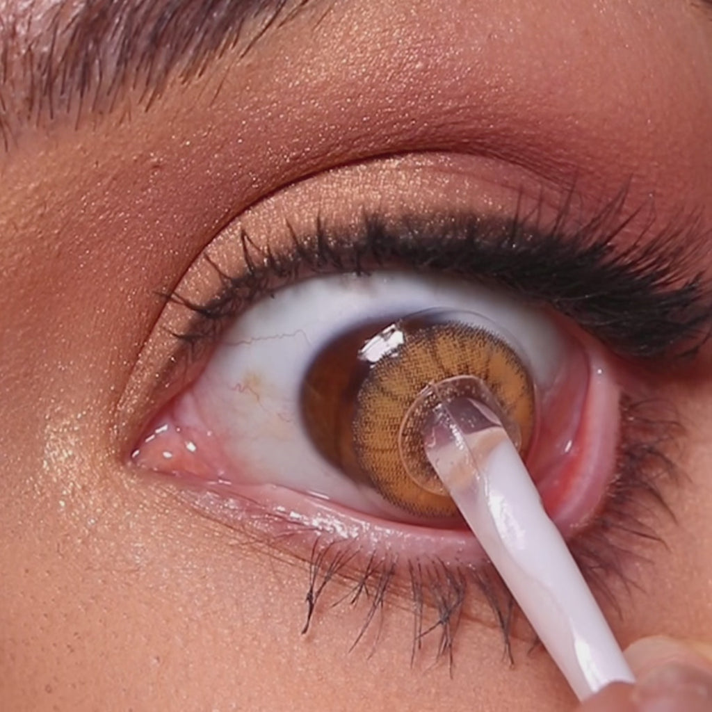 Model wearing EyeCandys Desire Toffee Brown colored contact lenses, showcasing a warm toffee brown eye transformation with close-up views, natural movement, and a naturally enhanced effect on brown eyes.