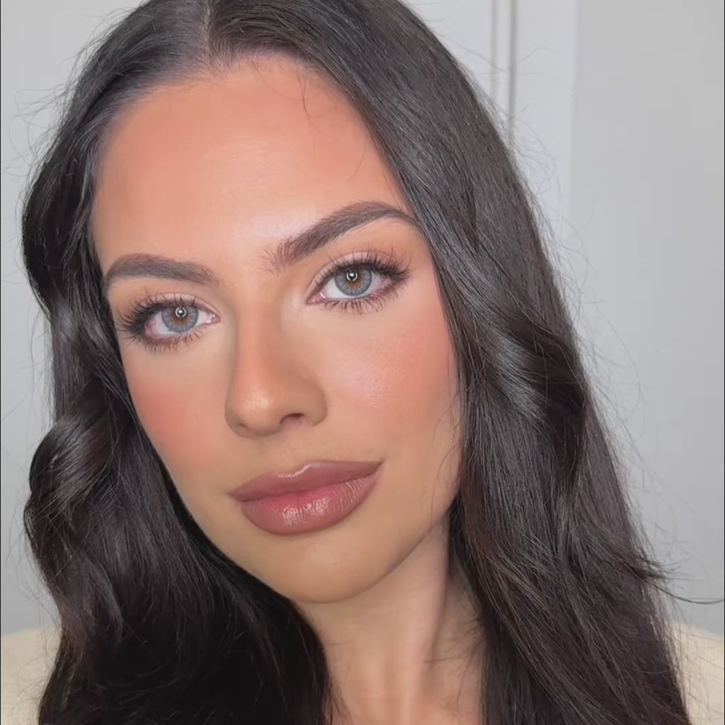 Model wearing EyeCandys Desire Glacier Blue colored contact lenses, showcasing a cool blue eye transformation with close-up views, natural movement, and a bright, icy effect on brown eyes.