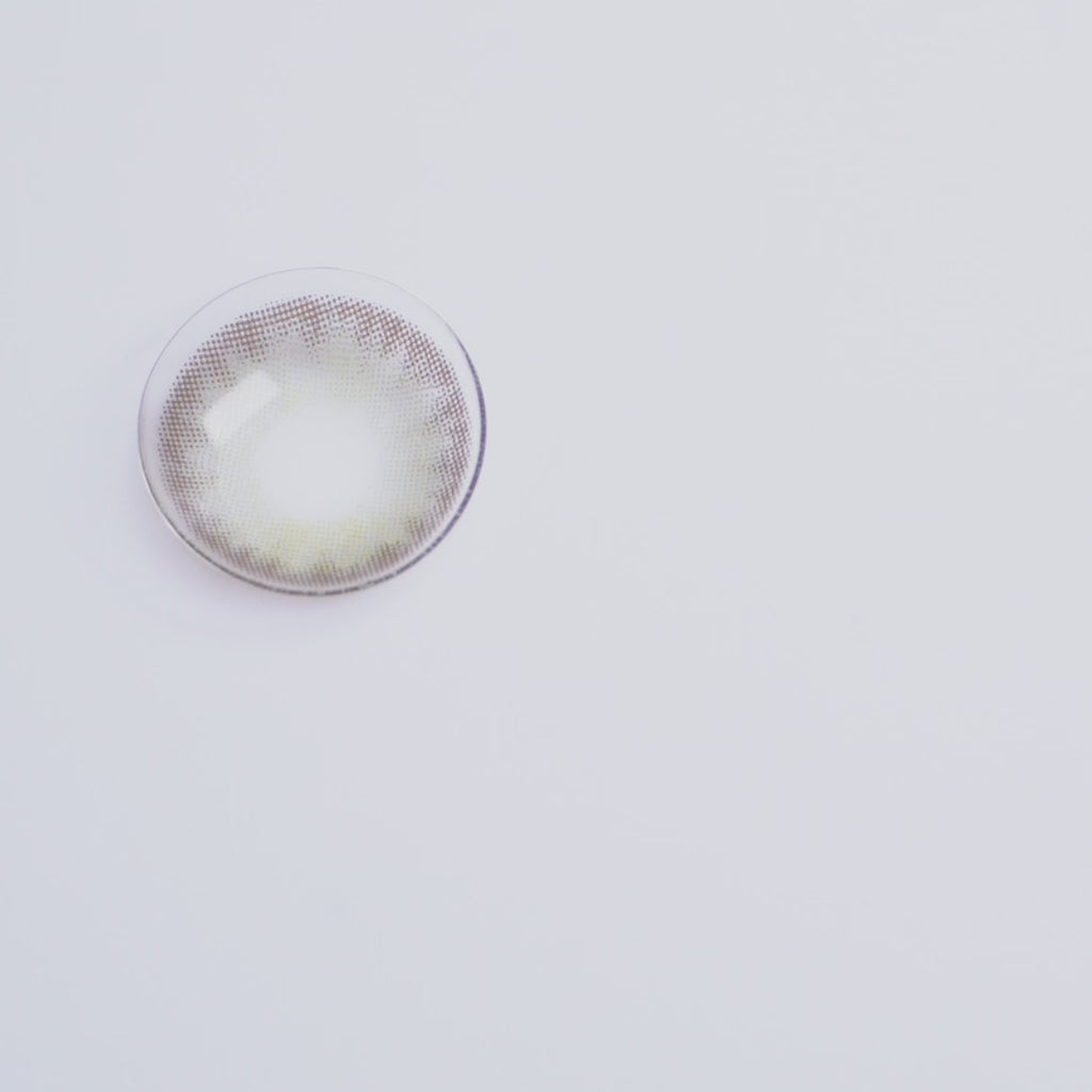 Video demonstration of a person applying coloured contact lenses, showcasing the transformation and enhancement of eye color with EyeCandys color contact lenses. Discover the ease and impact of wearing color contacts for a striking, natural look.