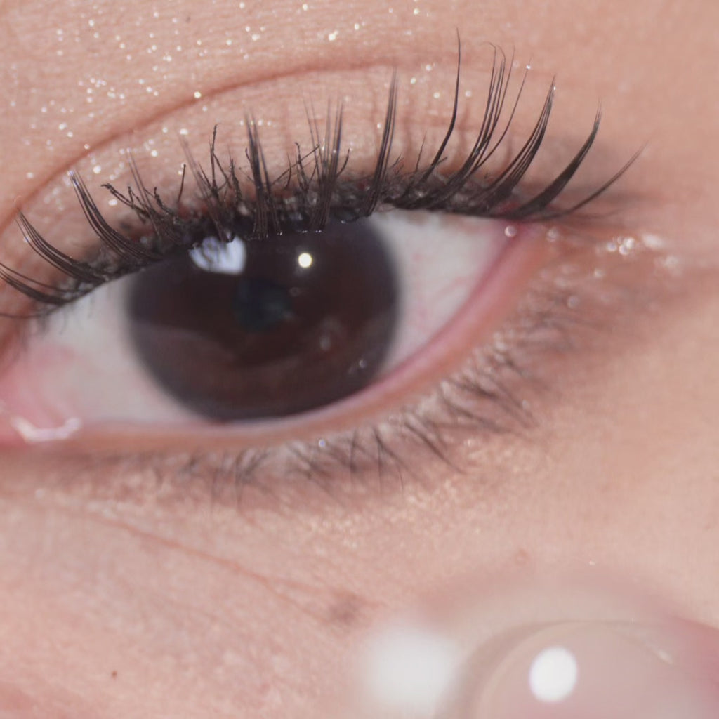 Close-up video of eye wearing EyeCandys Glossy Ivory 1-Day prescription colored contact lens, showing vibrant natural color, glossy finish, and comfortable daily wear, perfect for enhancing eye appearance