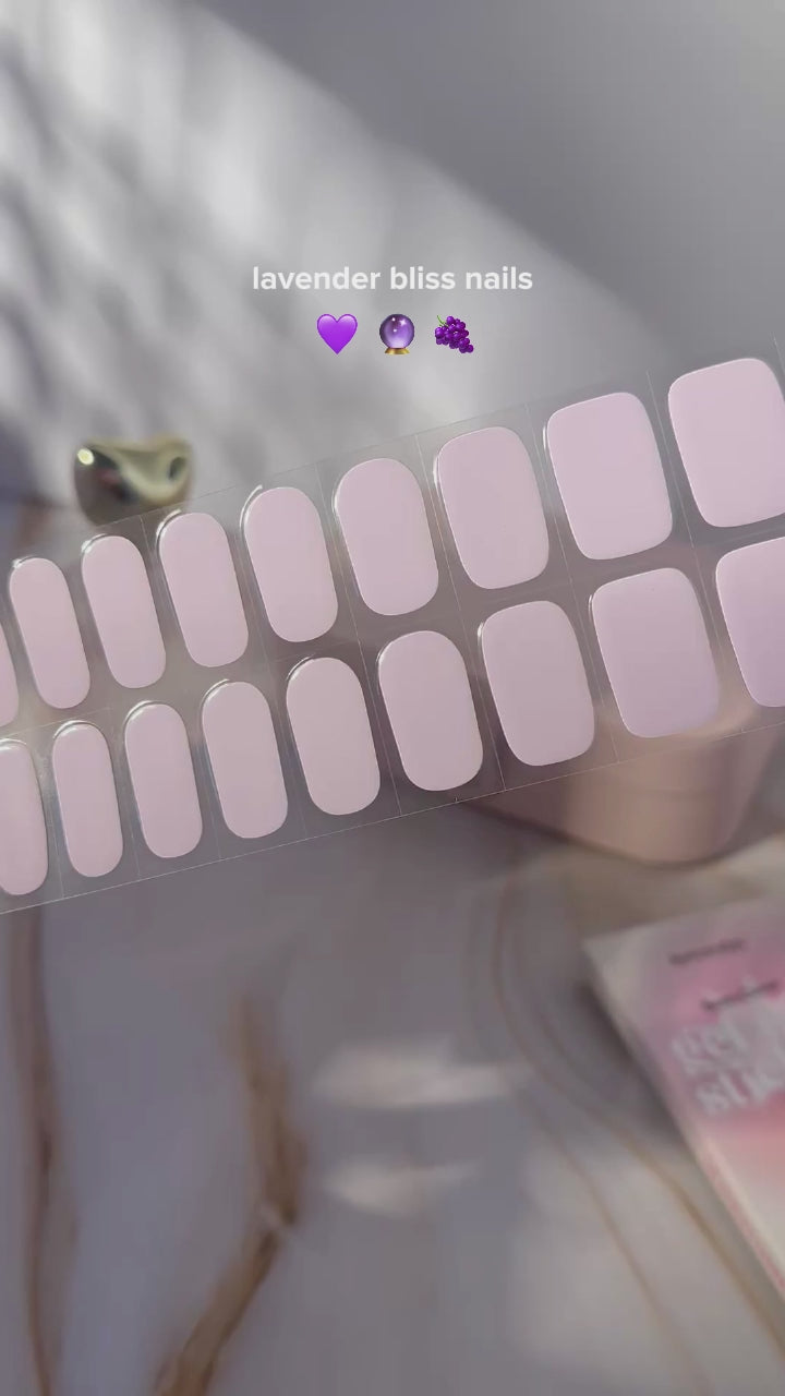 Applying EyeCandys French Lavender Gel Nail Stickers, featuring a chic lavender shade for effortless DIY nail art, salon-quality gel nails, and long-lasting nail wraps
