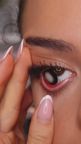A video featuring a model wearing EyeCandys Extra Magic Black prescription colored contact lenses, highlighting their bold look and unique style