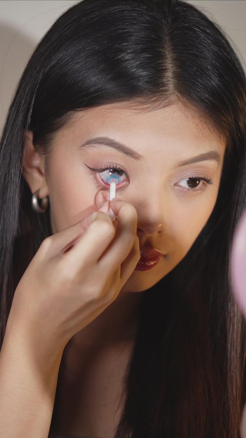 Try-on video of Eyecandys Aura Blue Grey prescription colored contact lenses on brown eyes, showcasing the dual-tone ocean blue pigment, soft grey halo, natural blend, and dramatic color transformation.