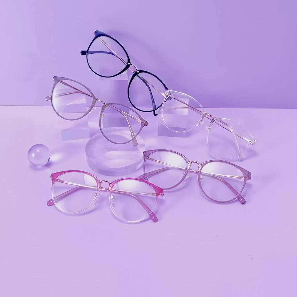 Infinity oversized prescription eyeglasses, available in blue light blocking lenses and in readers with magnification, from EyeCandys, filmed on a purple background