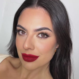 Model wearing EyeCandys Amelie Pink colored contact lenses, showcasing a soft pink eye transformation with close-up views, natural movement, and a bright, romantic look on brown eyes.