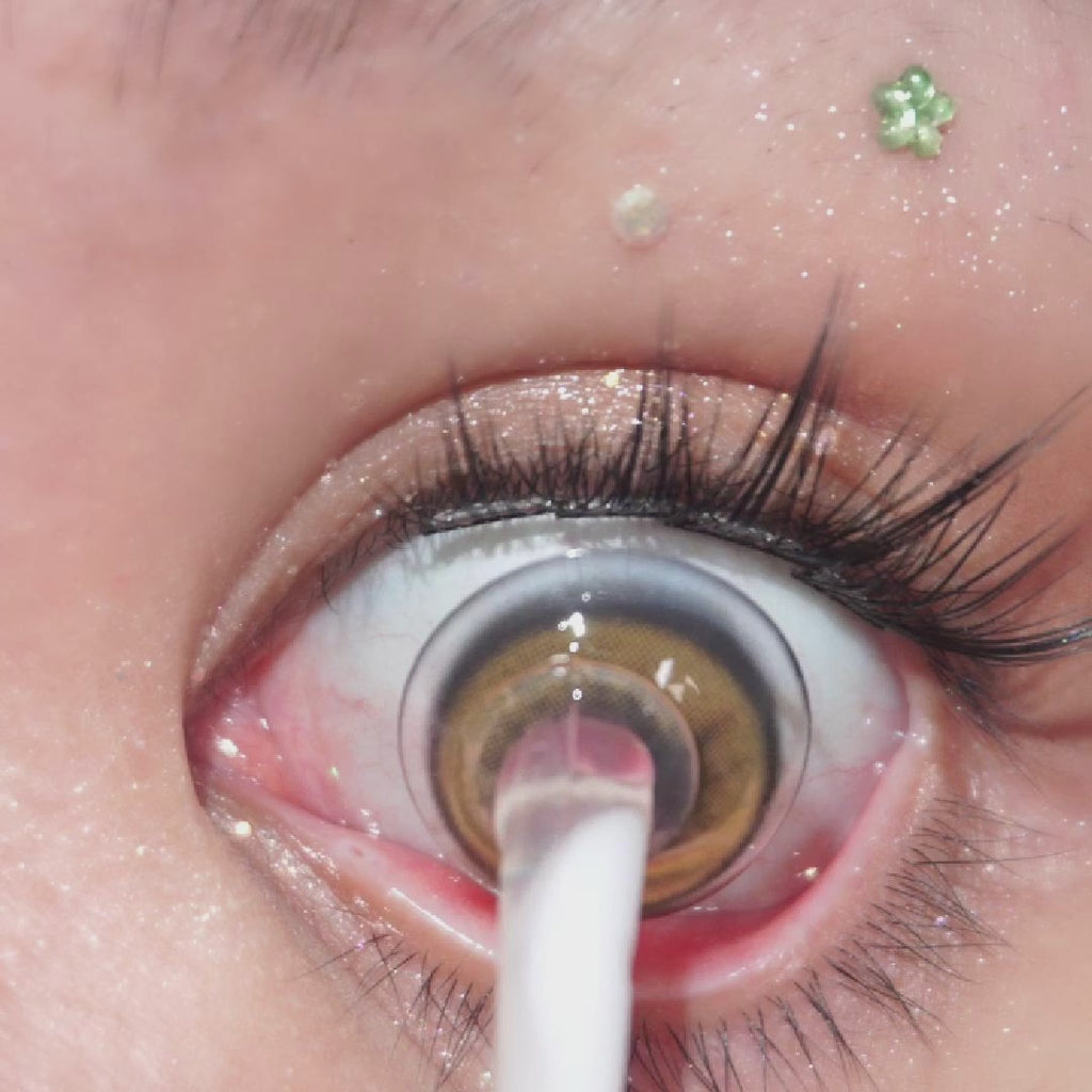 Close-up video of blinking eye with long lashes wearing EyeCandys Pink Label Barcelona Brown – natural-looking prescription colored contact lenses. Soft, comfortable color contact lenses that enhance brown eyes.