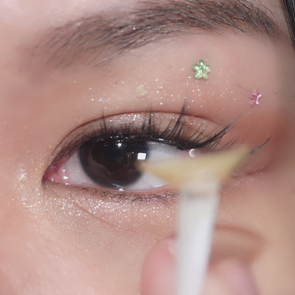 Close-up video of eye with long lashes wearing EyeCandys Pink Label Mykonos Brown – warm brown prescription colored contact lenses. Natural-looking color contact lenses for everyday comfort and style.