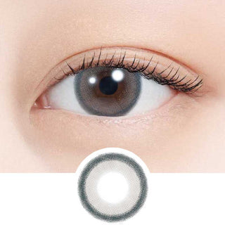 A close-up of an eye wearing N's Collection Sakana Grey (10pk) by N's Collection, with a detailed view below showing the daily disposable lens’s translucent gray pattern and clear center designed for myopia correction.