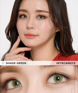 A fair-skinned woman with long brown hair wears EyeCandys Shade Green contacts. With subtle makeup, she poses near her face. A close-up below shows how the green color enhances her eyes. Text: "SHADE GREEN #EYECANDYS.