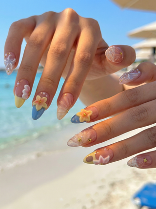 Hand wearing EyeCandys Shell Yeah press on nails featuring sandy nude base, 3D conch shell, starfish flower, and pearl ocean accents.