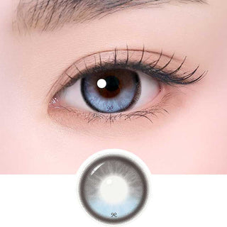 i-Sha Reborn Reborn Sky Veil color contact lens on top of a dark eye paired with subtle eye makeup and curled wispy eyelashes, above the contact lens design.

