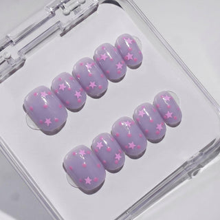EyeCandys Stardust Baby press on nails featuring muted lavender jelly nails with pink star sequins and hot pink dot confetti.