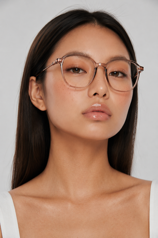 EyeCandys Status Round clear lens glasses model shot featuring stylish round optical frames with non-prescription clear lenses, trendy women's fashion eyewear, prescription-ready glasses, blue light style frames for everyday wear, office outfits, minimalist fashion, and modern luxury looks.