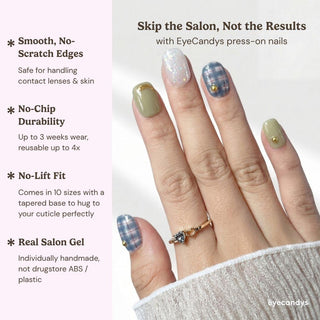 Hand wearing EyeCandys Study Hall press on nails featuring blue plaid nails, sage green base, and gold detailing.