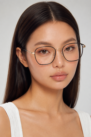 EyeCandys Therese Oversized Square Black Gold glasses model shot featuring oversized black square frames with gold accents and non-prescription clear lenses, trendy women's fashion eyewear, blue light style glasses for everyday wear, office outfits, minimalist fashion, and modern luxury looks.