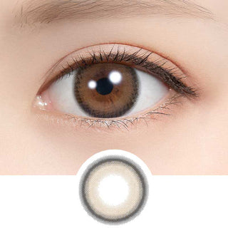 A close-up of a brown eye wearing Feliamo 1-Day Tiramisu Ring (10pk) contacts from Feliamo, with an insert below highlighting the lens’s dark ring and light inner area.