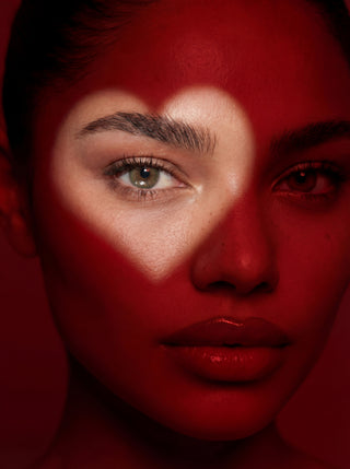 Model wearing EyeCandys Cashmere Satin Olive colored contact lenses for Valentine’s, showing close-up of eyes with long lashes, natural olive-toned color blending, subtle eye enlargement, and an elegant, romantic look.