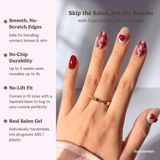Stylish hand wearing Very Cherry press on nails featuring bold cherry red color, playful 3D fruit accents, and gold linework.